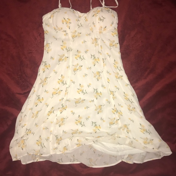 white sundress with yellow flowers